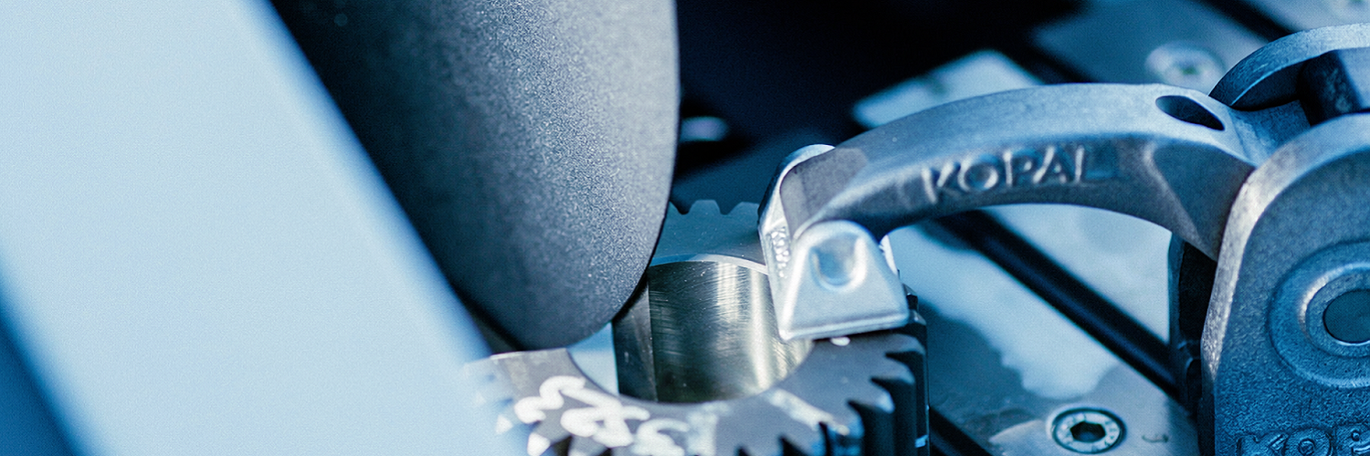 260126_CERTANIA_CIA_AI_closeup_gear_teeth_machining_process_with_grinding_wheel